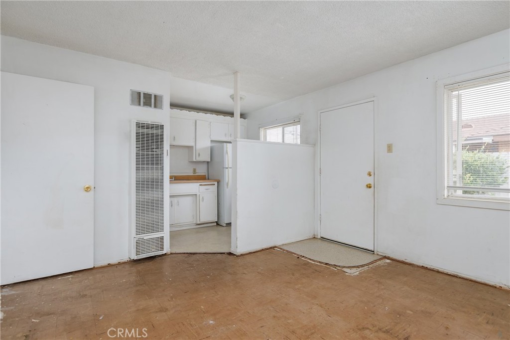 321 North K Street Lompoc, CA 93436 - Photo 18 of 32 a view of a kitchen with a sink and a refrigerator