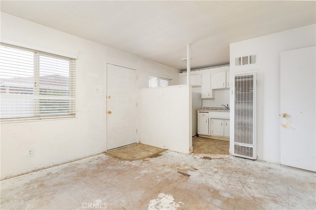 321 North K Street Lompoc, CA 93436 - Photo 23 of 32 a view of a kitchen with a closet and a window