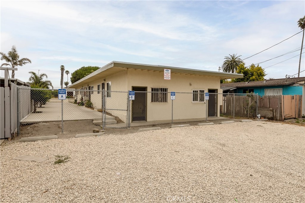321 North K Street Lompoc, CA 93436 - Photo 27 of 32 a view of a house with wooden fence