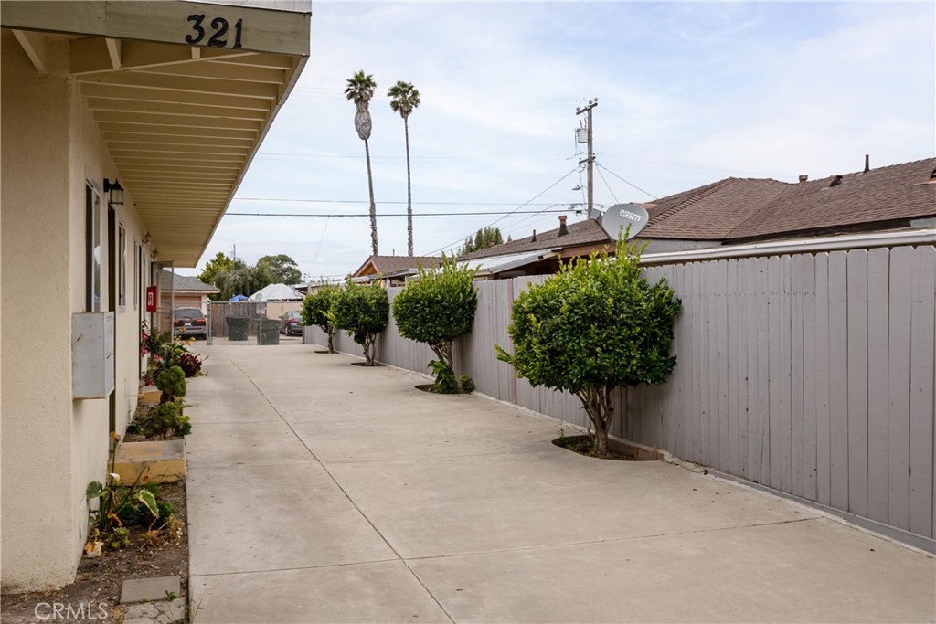 321 North K Street Lompoc, CA 93436 - Photo 3 of 32 a potted plant sitting in front of a house