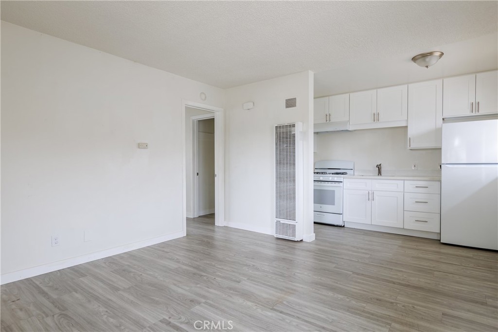 321 North K Street Lompoc, CA 93436 - Photo 6 of 32 a view of kitchen with wooden floor