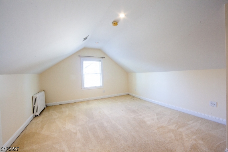 16 Columbus Avenue Glen Ridge, NJ 07028 - Photo 5 of 14 an empty room with a window