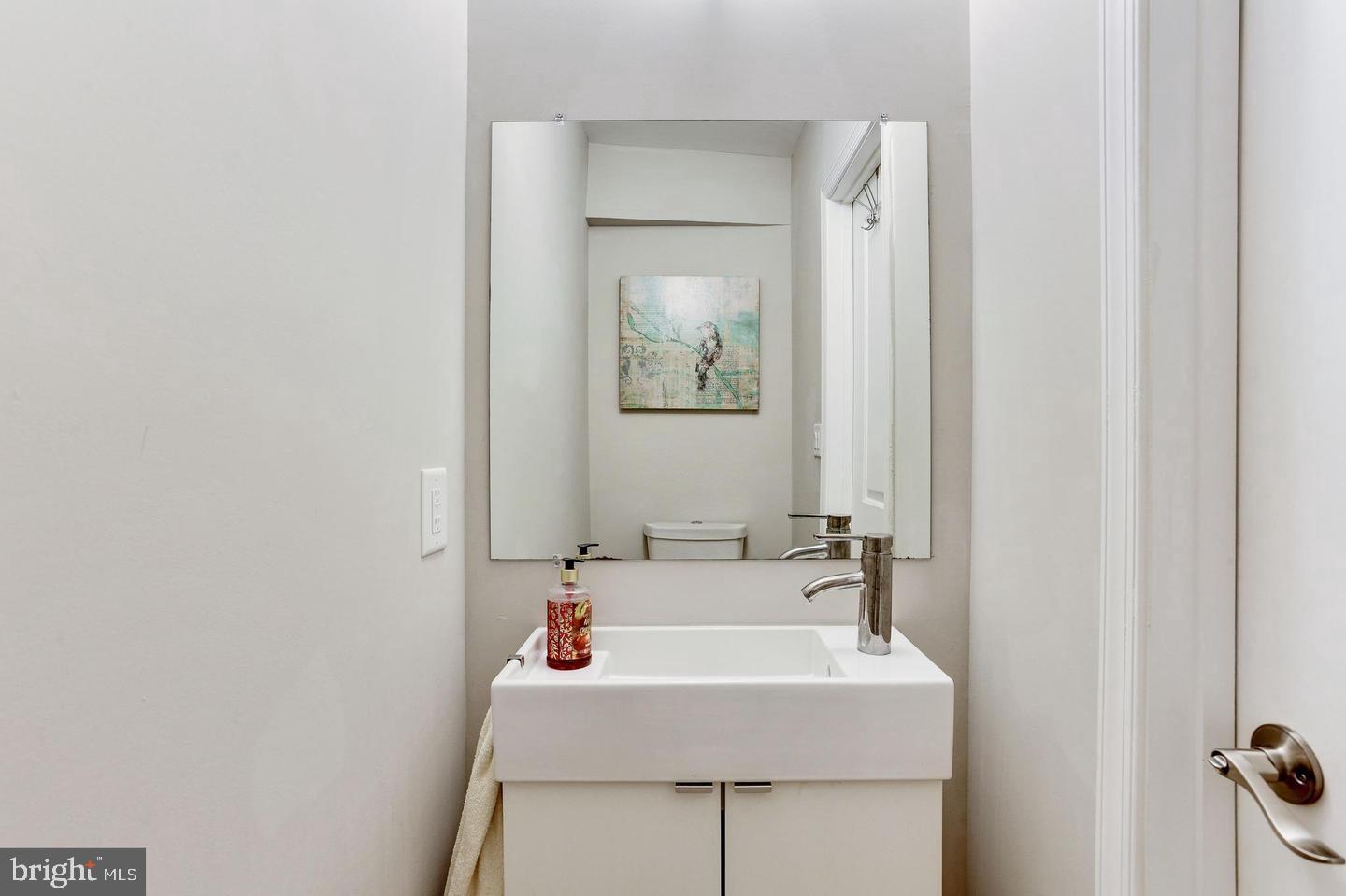 1816 Minnesota Avenue Southeast Washington, DC 20020 - Photo 9 of 13 a bathroom with a sink and a mirror