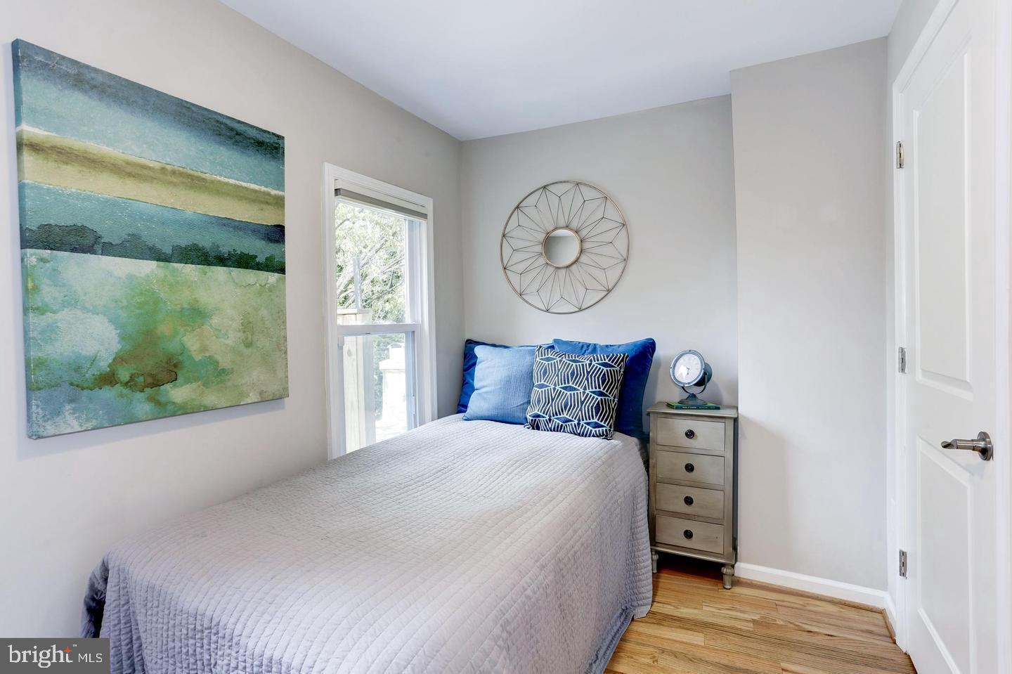 1816 Minnesota Avenue Southeast Washington, DC 20020 - Photo 10 of 13 a bedroom with a bed and a large window