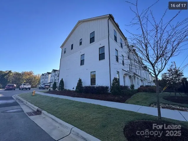 a view of a building with a yard