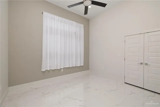 an empty room with fan