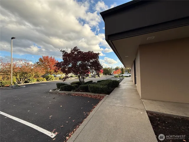 a view of a street with cars on the road