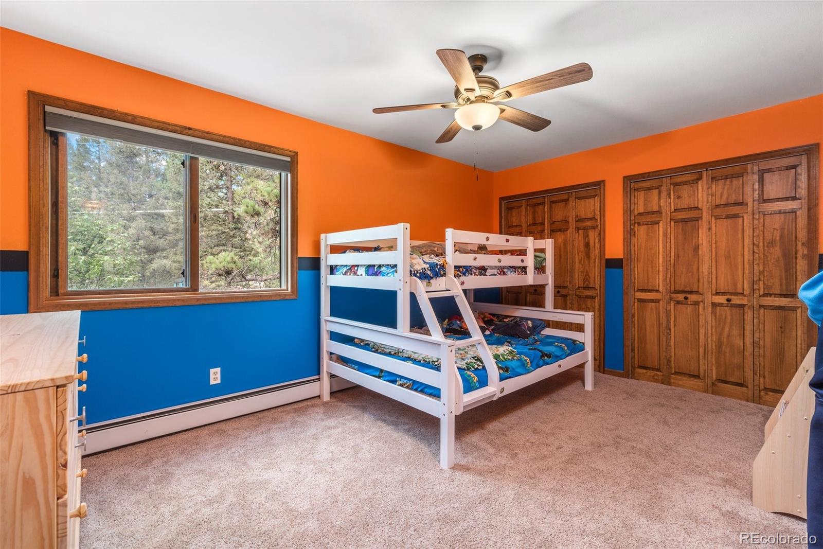 30540 Rand Road Conifer, CO 80433 - Photo 15 of 37 a bedroom with a bed and a window