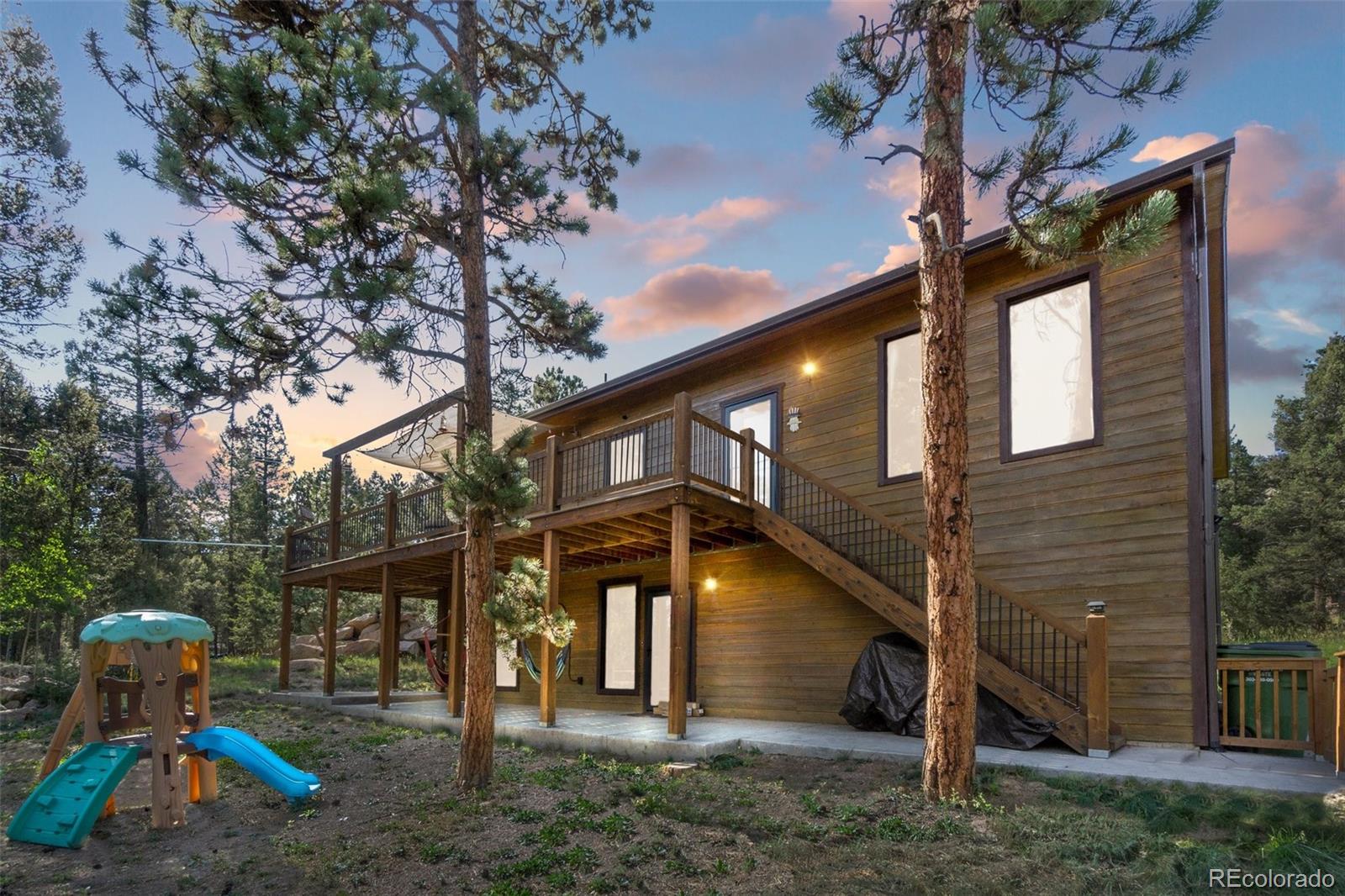 30540 Rand Road Conifer, CO 80433 - Photo 2 of 37 a view of a house with a yard