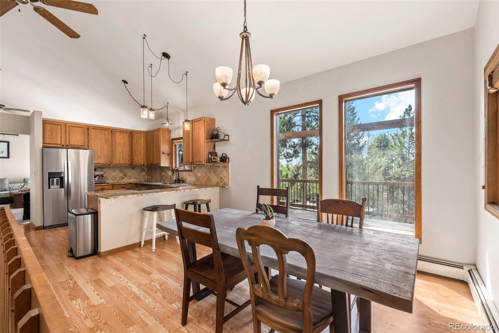 30540 Rand Road Conifer, CO 80433 - Photo 5 of 37 a view of a dining room with furniture window and outside view