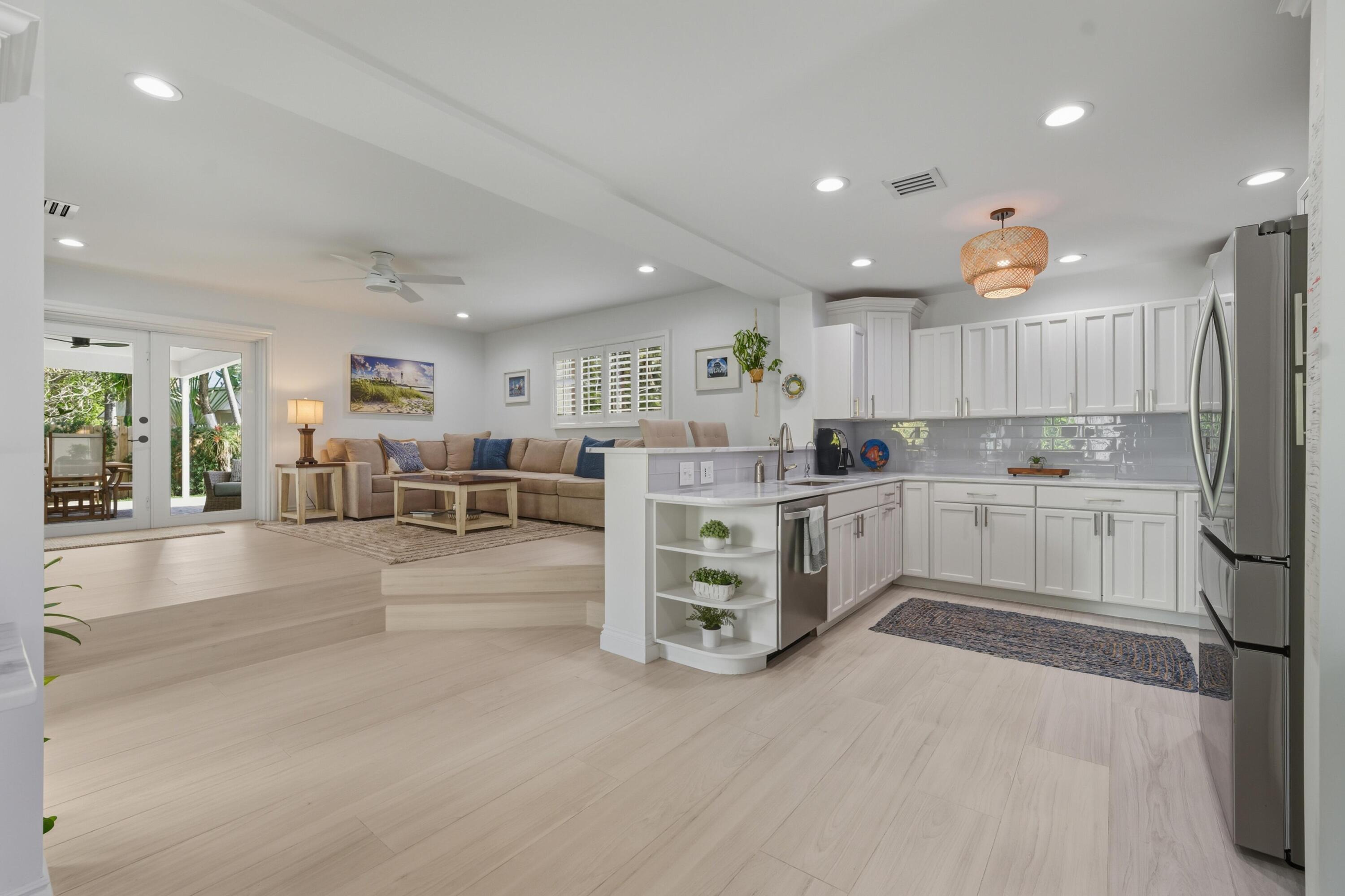 2642 Northeast 26th Terrace Lighthouse Point, FL 33064 - Photo 33 of 53 a kitchen with white cabinets and counter space