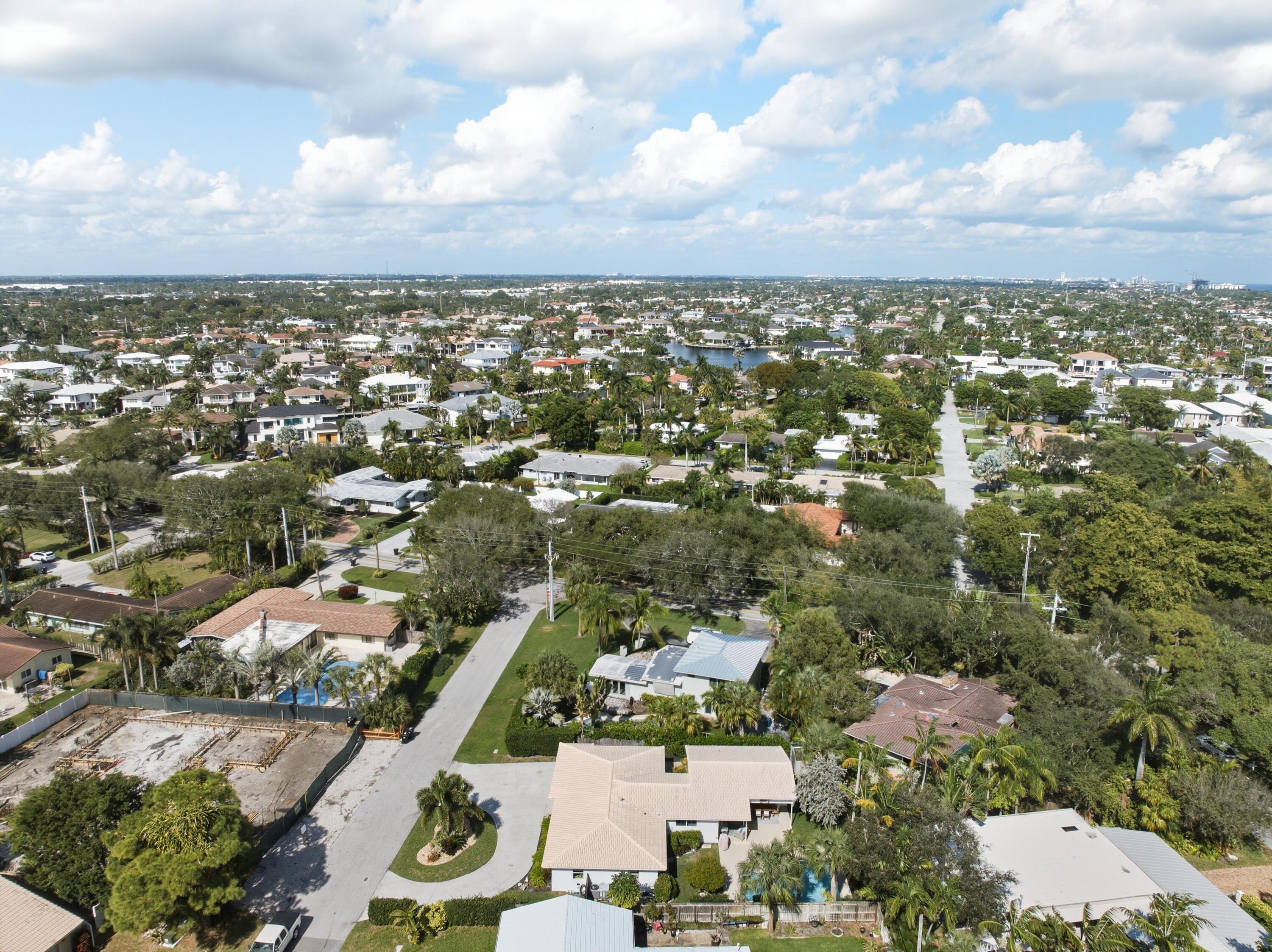 2642 Northeast 26th Terrace Lighthouse Point, FL 33064 - Photo 48 of 53 an aerial view of residential building and car parked side of city