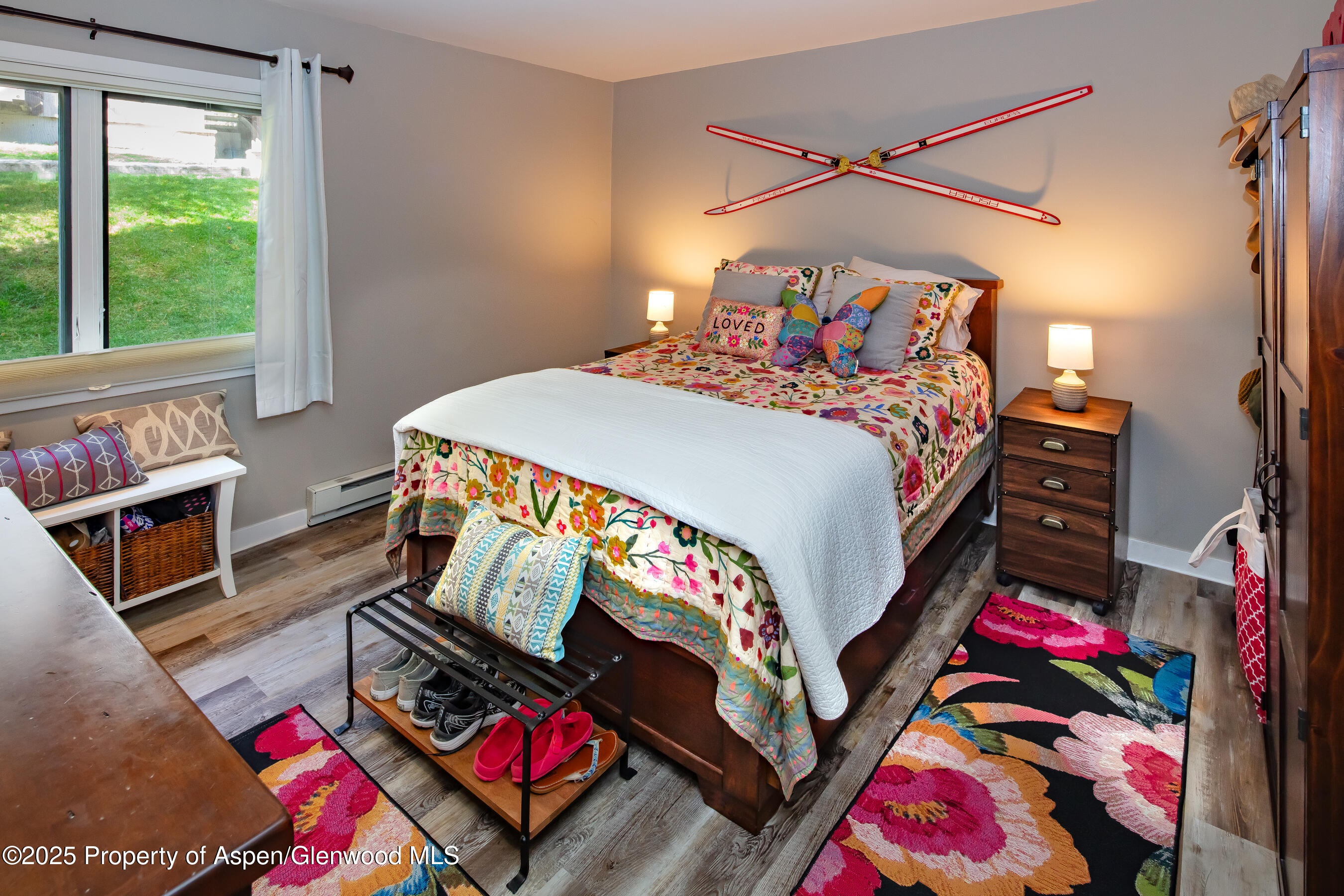 35 Upper Woodbridge Road, Unit 28A Snowmass Village, CO 81615 - Photo 11 of 13 a bedroom with bed and a window