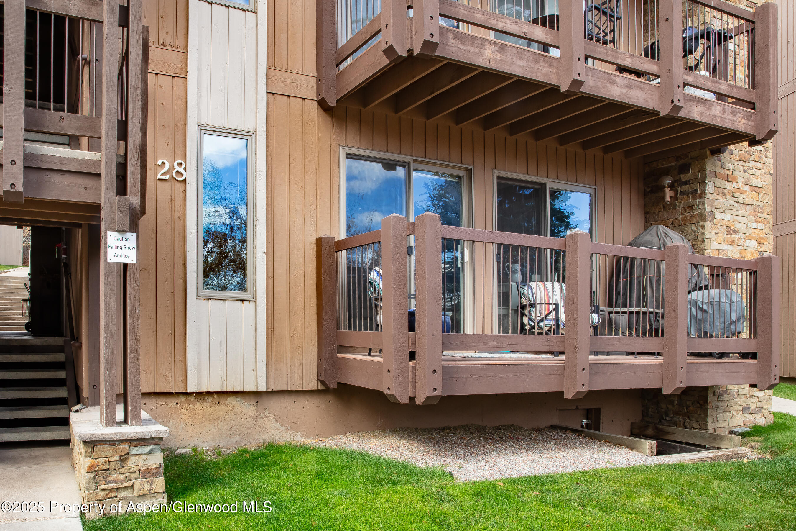 35 Upper Woodbridge Road, Unit 28A Snowmass Village, CO 81615 - Photo 2 of 13 a view of front door with outdoor seating
