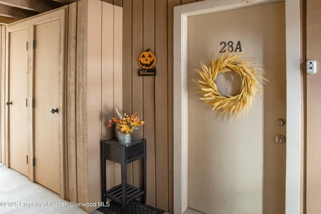 a dining room with a door and wooden floor