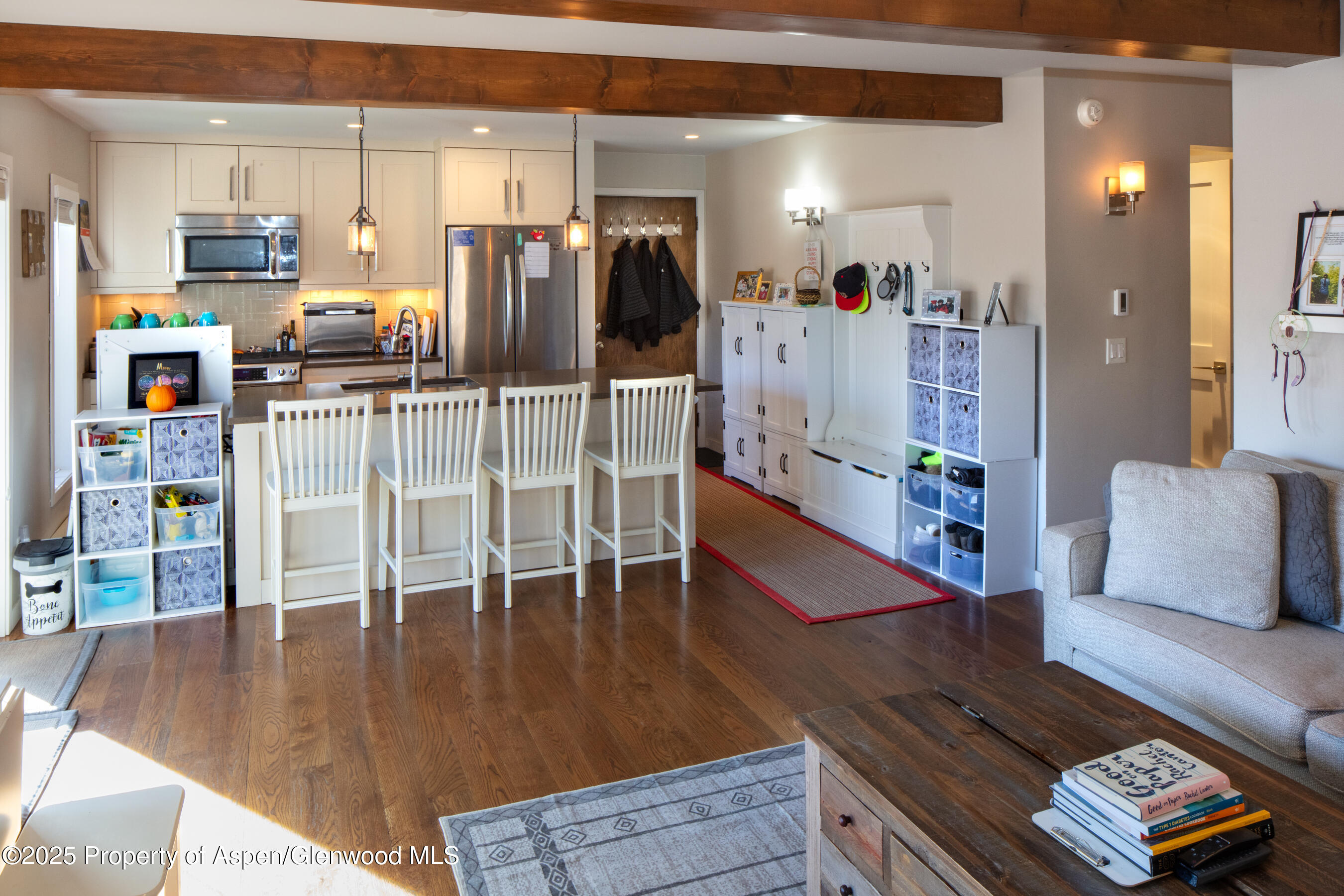 35 Upper Woodbridge Road, Unit 28A Snowmass Village, CO 81615 - Photo 7 of 13 a living room with furniture and wooden floor