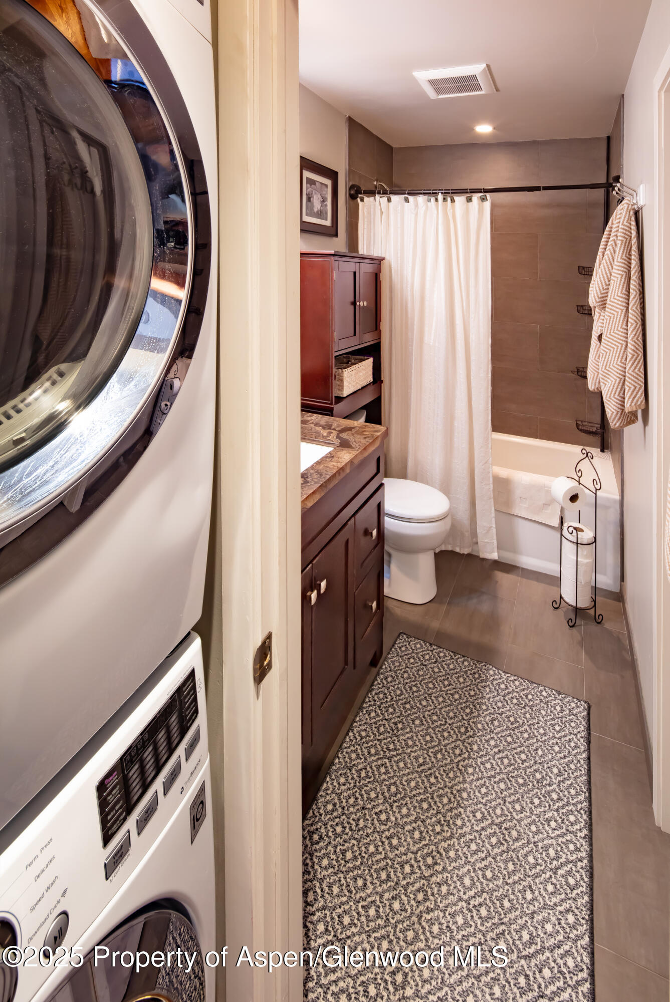 35 Upper Woodbridge Road, Unit 28A Snowmass Village, CO 81615 - Photo 9 of 13 a bathroom with a sink a toilet and shower