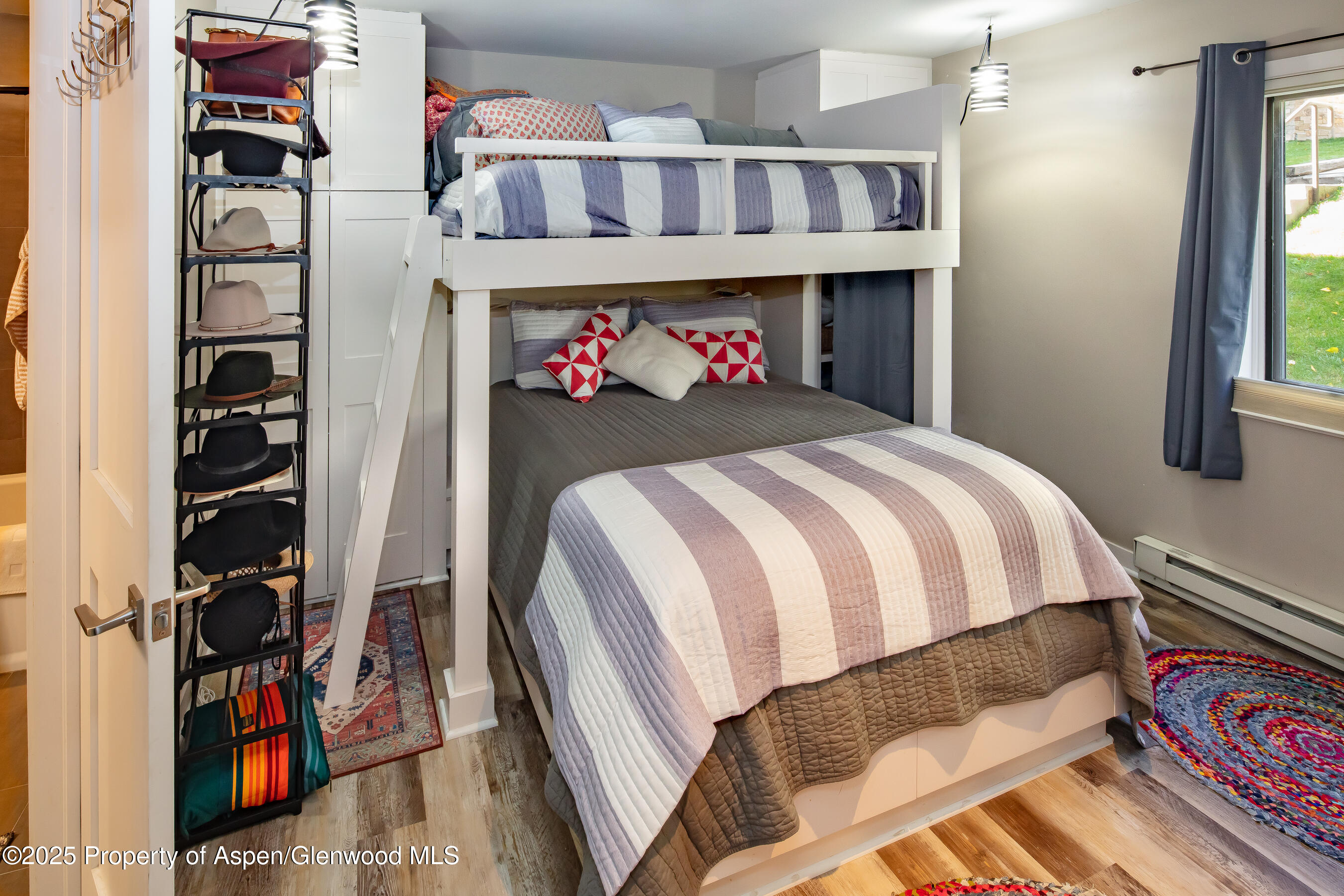 35 Upper Woodbridge Road, Unit 28A Snowmass Village, CO 81615 - Photo 10 of 13 a bed room with a bed and a closet