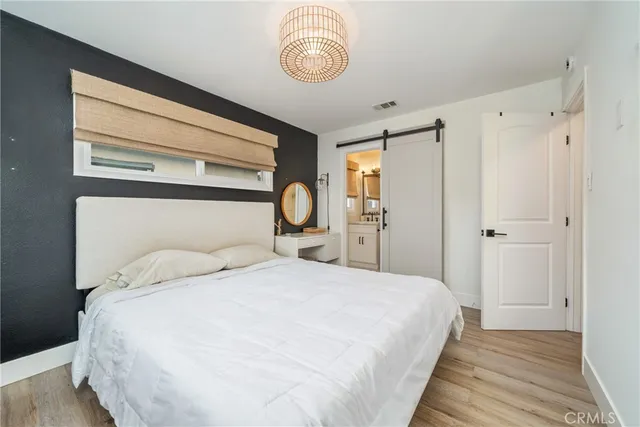 a bedroom with a bed and a closet