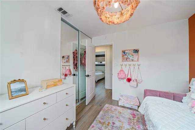 a bedroom with bed and cabinets