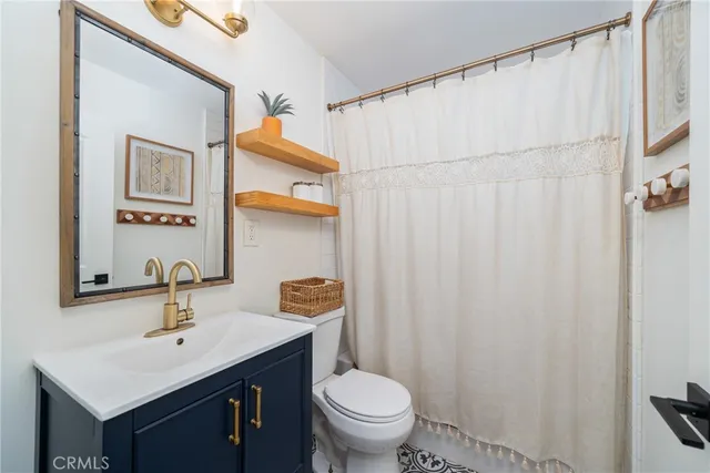 a bathroom with a sink toilet and vanity
