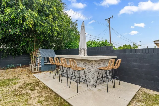 a view of a chairs and table in the patio