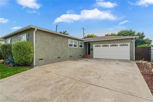 an aerial view of a city with lots of residential buildings and ocean view