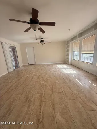 a view of empty room with windows