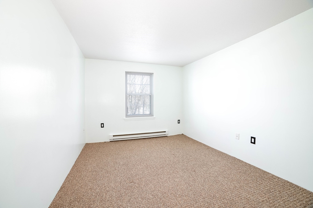 80 Stanton Street, Unit 32 Worcester, MA 01605 - Photo 17 of 20 a view of an empty room with a window