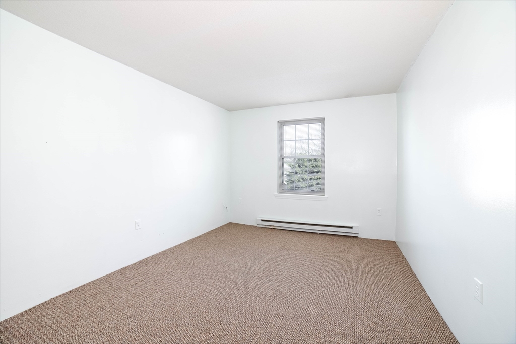 80 Stanton Street, Unit 32 Worcester, MA 01605 - Photo 20 of 20 an empty room with windows