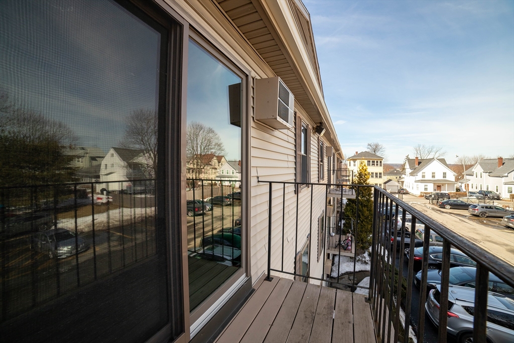 80 Stanton Street, Unit 32 Worcester, MA 01605 - Photo 4 of 20 a view of balcony with wooden floor