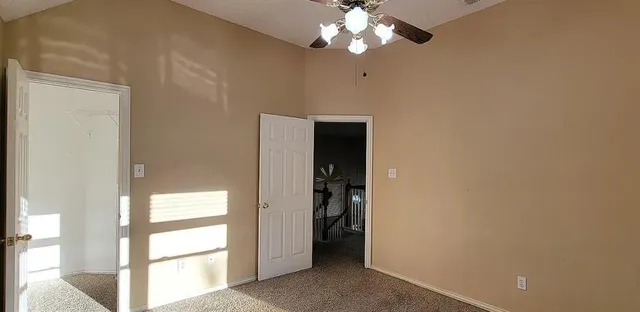 a bathroom with a granite countertop sink a mirror and a shower