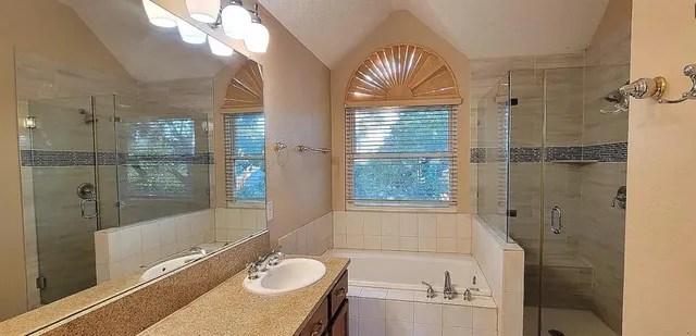 a view of a room with a ceiling fan