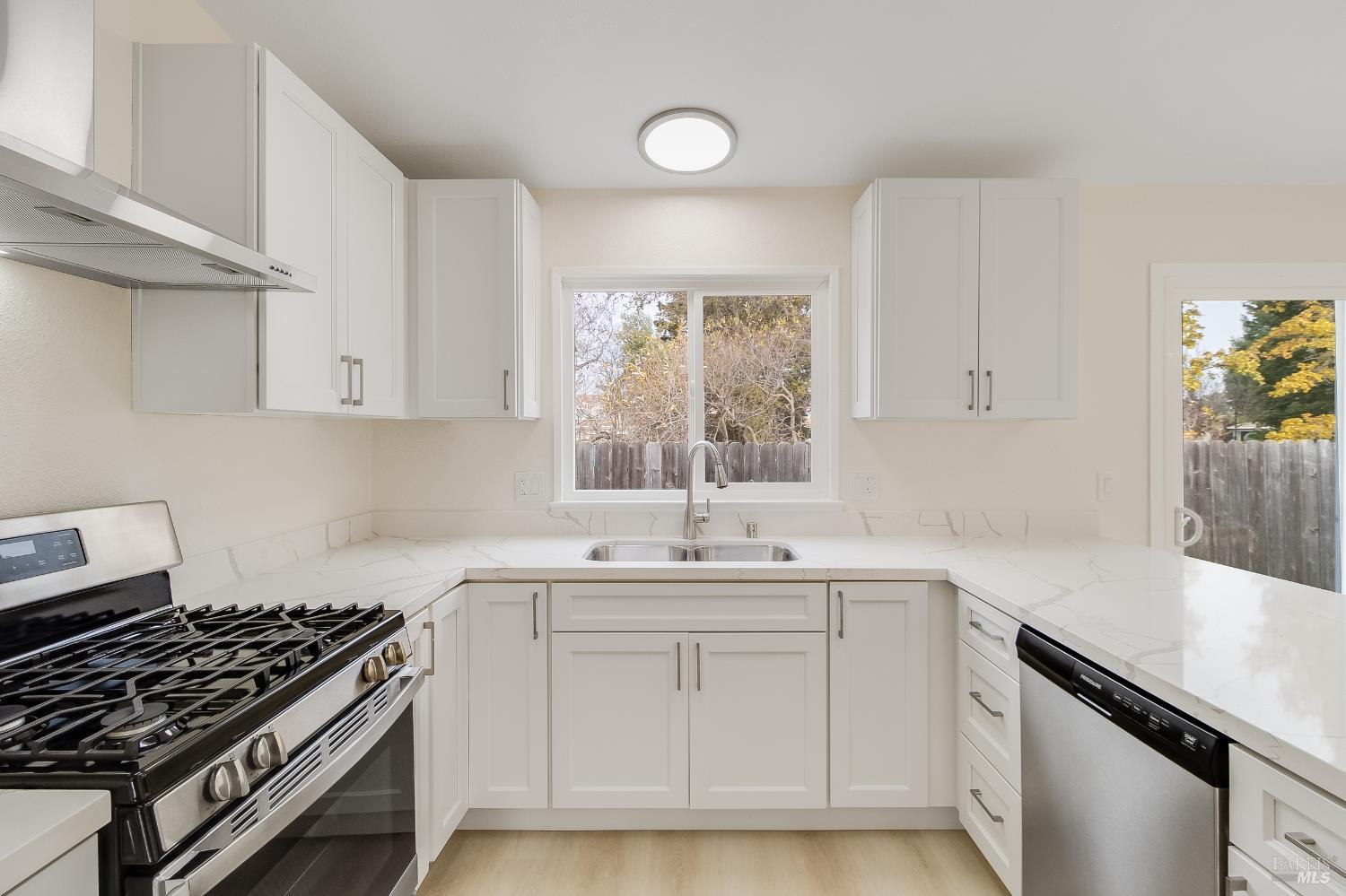 2555 Flosden Road, Unit 8 American Canyon, CA 94503 - Photo 16 of 58 a kitchen with a sink stove and cabinets
