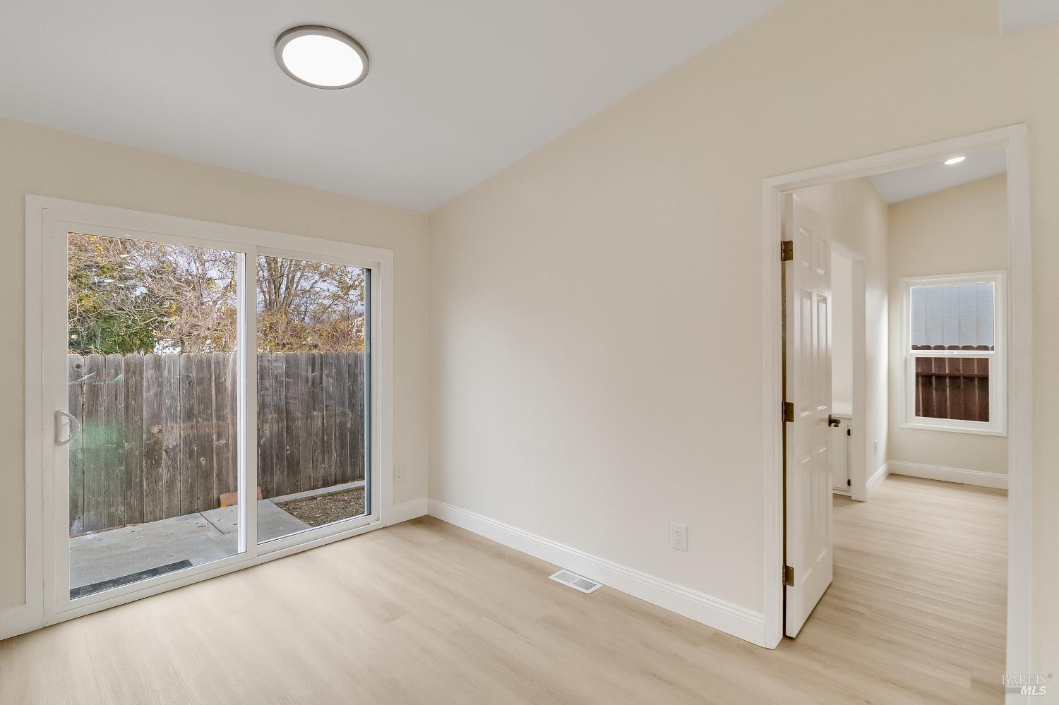 2555 Flosden Road, Unit 8 American Canyon, CA 94503 - Photo 19 of 58 an empty room with windows and entrance
