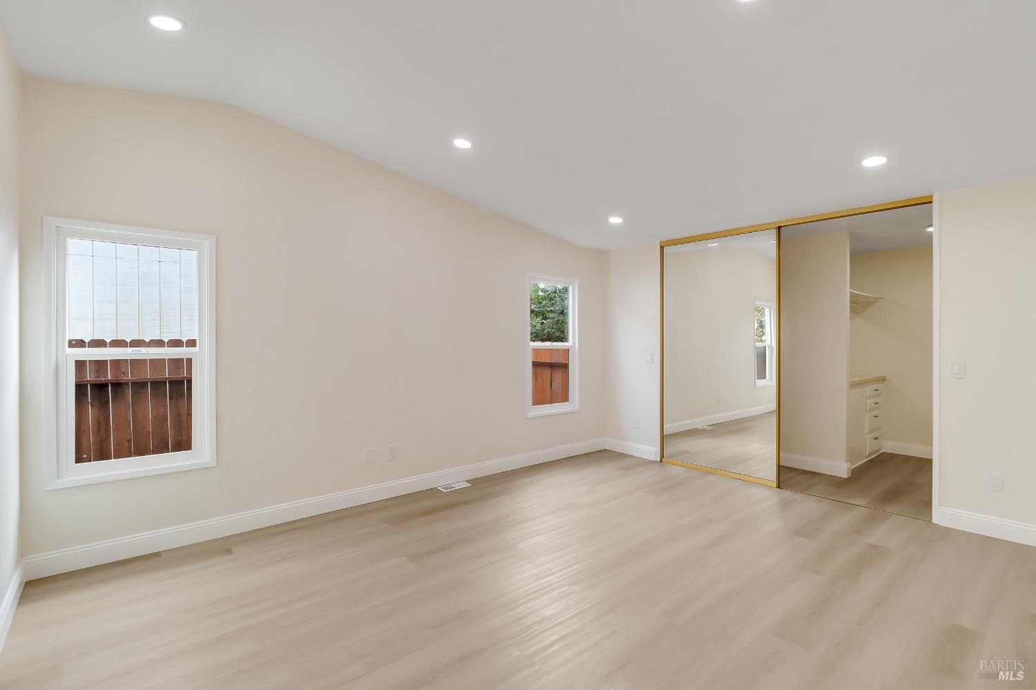 2555 Flosden Road, Unit 8 American Canyon, CA 94503 - Photo 20 of 58 an empty room with wooden floor and a window