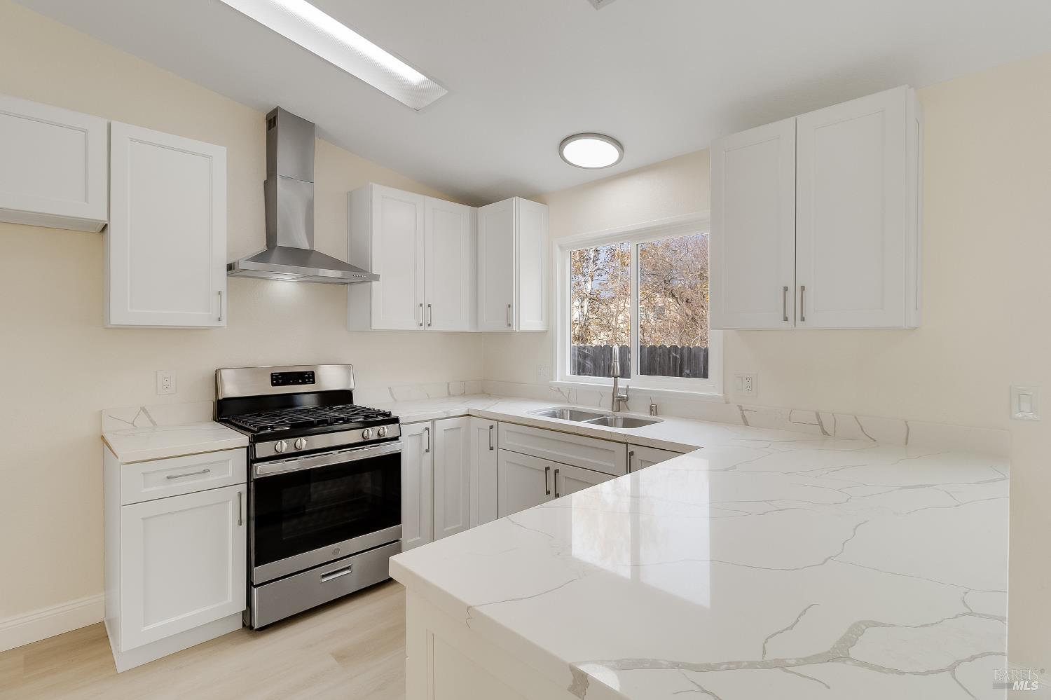 2555 Flosden Road, Unit 8 American Canyon, CA 94503 - Photo 2 of 58 a kitchen with white cabinets and appliances