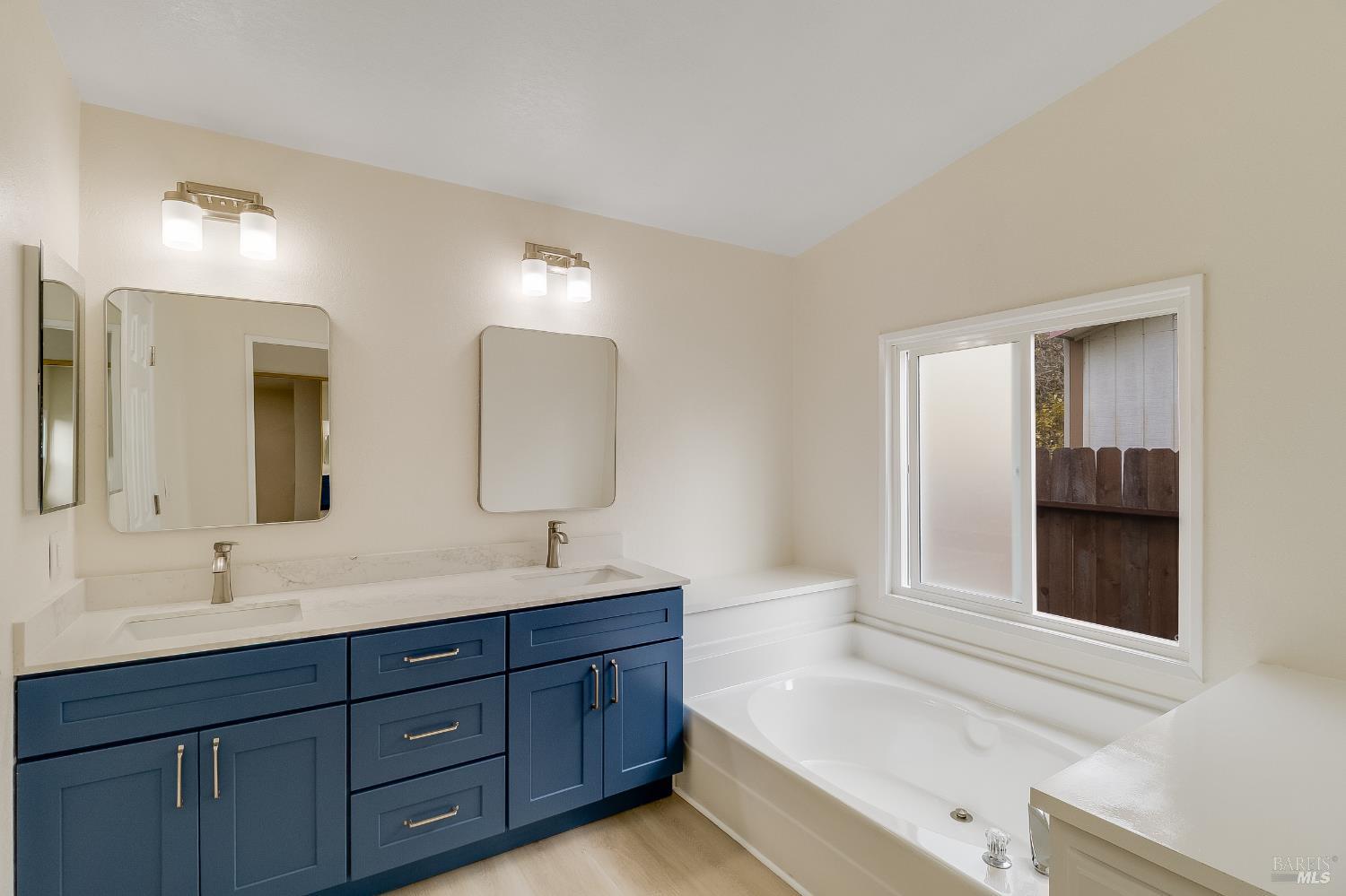 2555 Flosden Road, Unit 8 American Canyon, CA 94503 - Photo 25 of 58 a bathroom with a tub sink and mirror