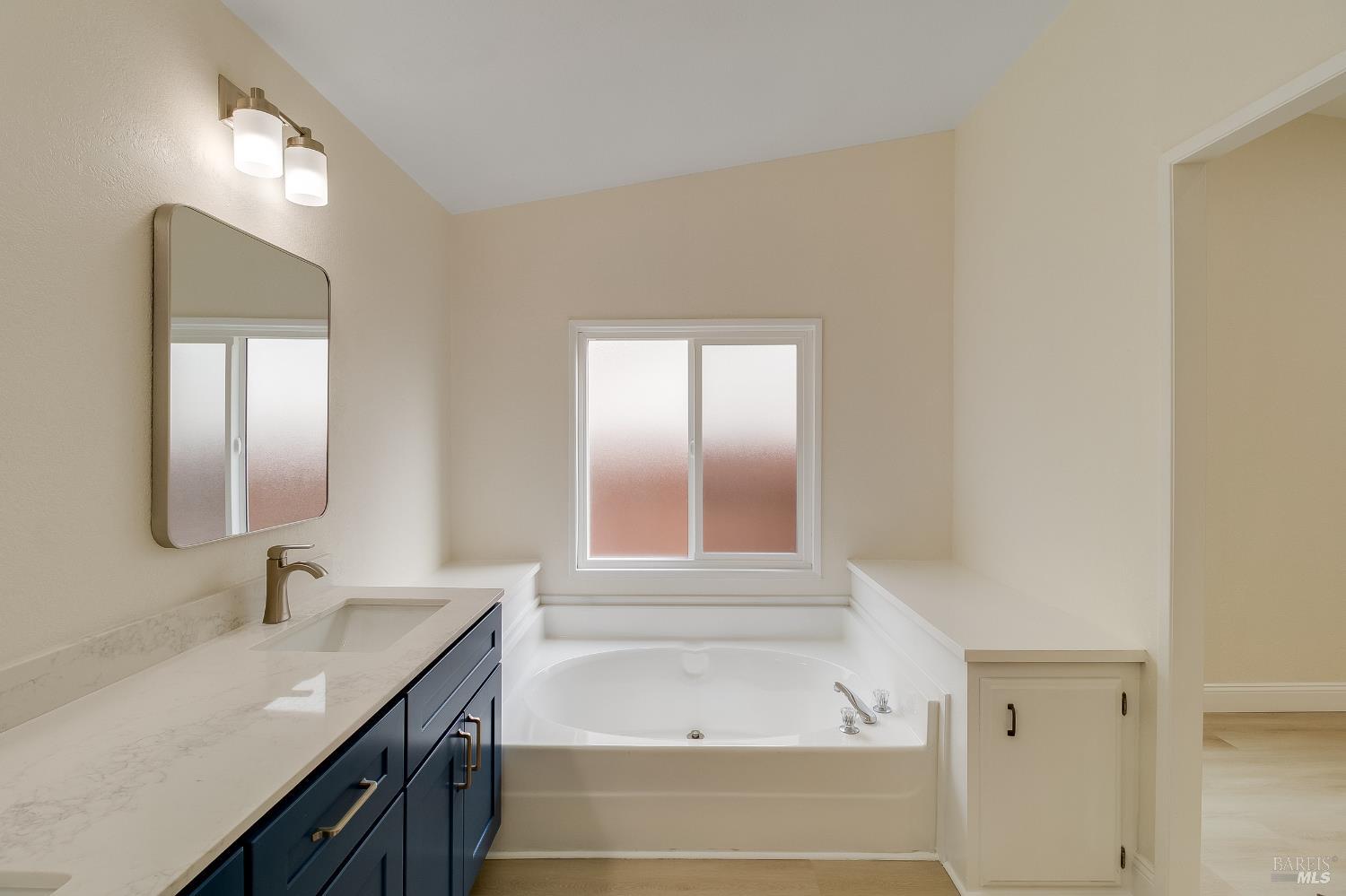 2555 Flosden Road, Unit 8 American Canyon, CA 94503 - Photo 26 of 58 a bathroom with a tub sink and mirror