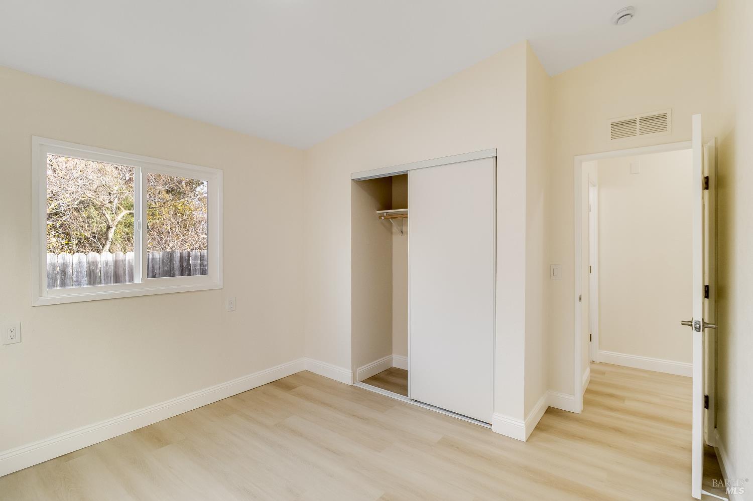 2555 Flosden Road, Unit 8 American Canyon, CA 94503 - Photo 34 of 58 an empty room with wooden floor and windows