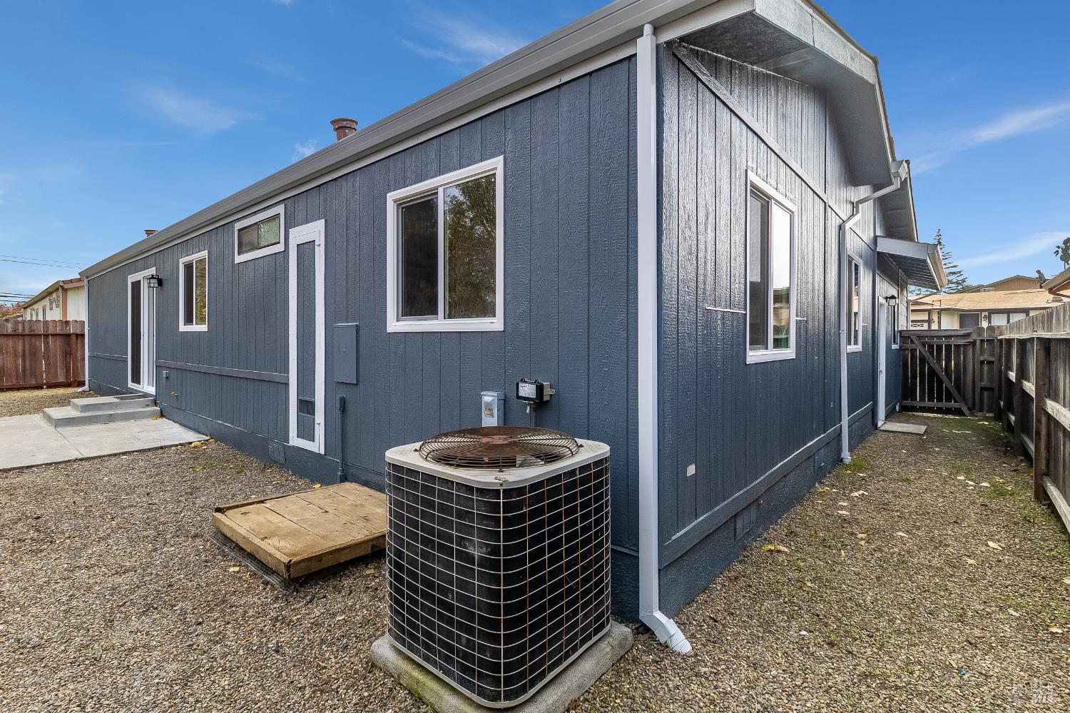2555 Flosden Road, Unit 8 American Canyon, CA 94503 - Photo 42 of 58 a backyard of a house with barbeque oven table and chairs