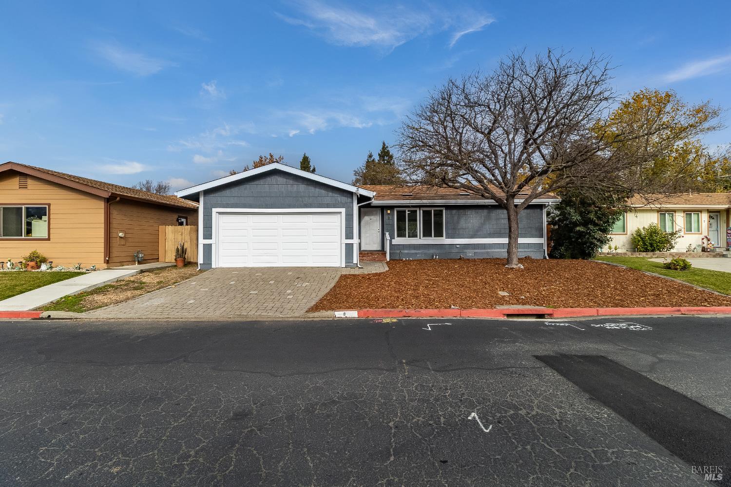 2555 Flosden Road, Unit 8 American Canyon, CA 94503 - Photo 5 of 58 a front view of a house with a yard and garage