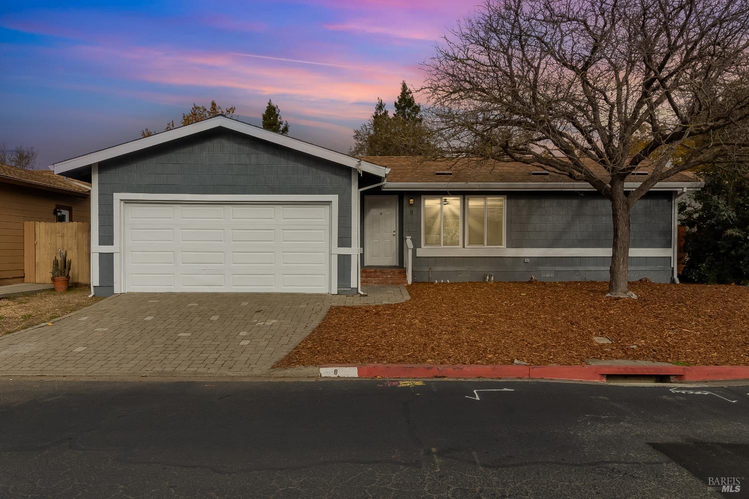 2555 Flosden Road, Unit 8 American Canyon, CA 94503 - Photo 57 of 58 a front view of a house with a yard and garage