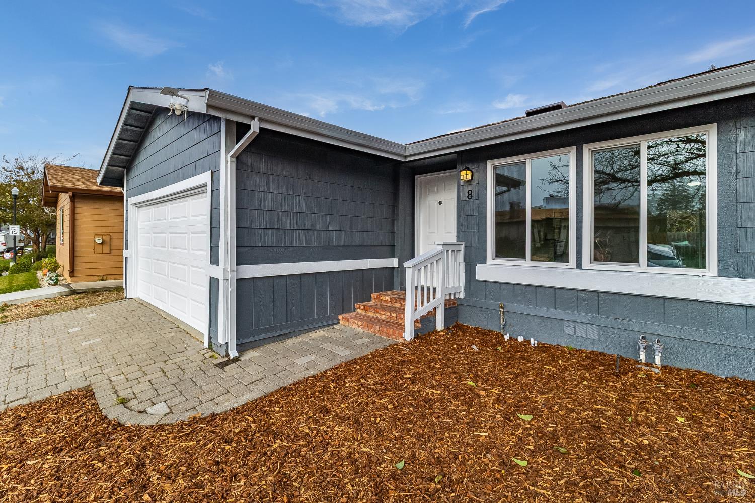 2555 Flosden Road, Unit 8 American Canyon, CA 94503 - Photo 9 of 58 a house with a large window and wooden fence