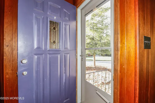 a view of livingroom with furniture and a fireplace