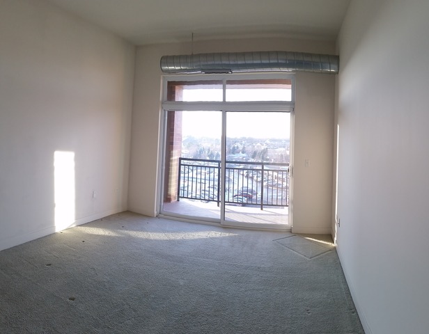 450 Village Center Drive, Unit 414 Burr Ridge, IL 60527 - Photo 5 of 10 a view of an empty room with a window