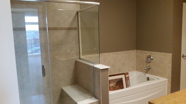 450 Village Center Drive, Unit 414 Burr Ridge, IL 60527 - Photo 7 of 10 a bathroom with a tub and shower