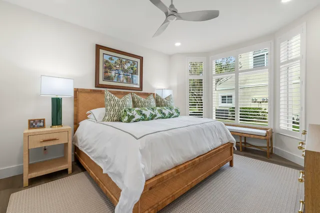 a row of palm trees and swimming pool in the backyard of a house