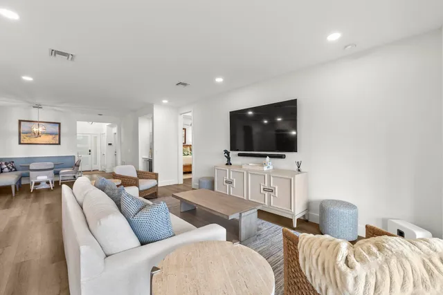 a kitchen with white cabinets stainless steel appliances and sink