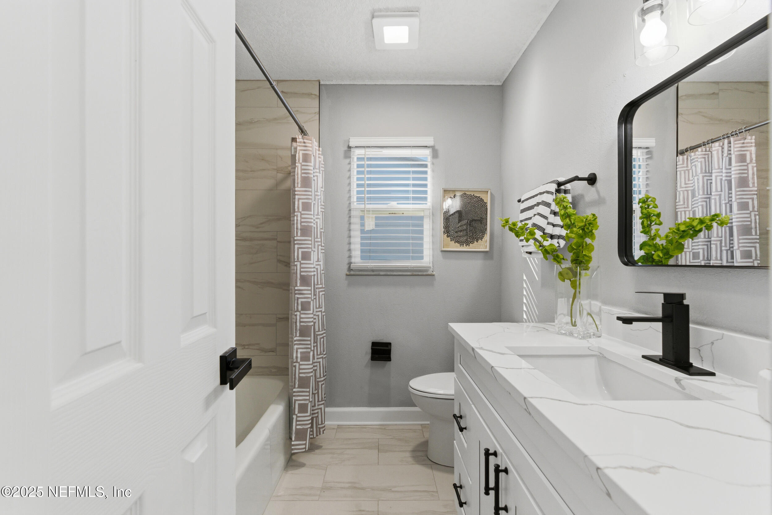 3631 North Ride Drive Jacksonville, FL 32223 - Photo 13 of 30 a bathroom with a sink toilet and shower